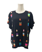 Black t-shirt with colorful lip print on a mannequin against a white background