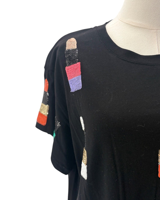 Black t-shirt with colorful pencil designs on a mannequin against a white background