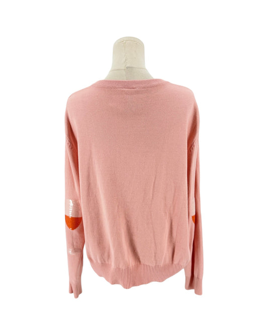 A light pink knit sweater displayed on a mannequin from the back, featuring orange elbow patches and white embroidered details on the sleeves.