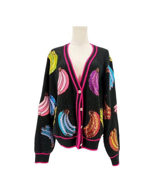 A black knit cardigan sweater featuring colorful sequined banana motifs and bright pink trim, displayed on a mannequin torso against a plain white background.