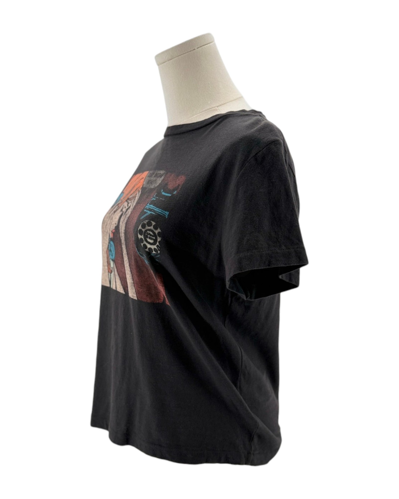 Black t-shirt with a colorful graphic on a mannequin against a white background