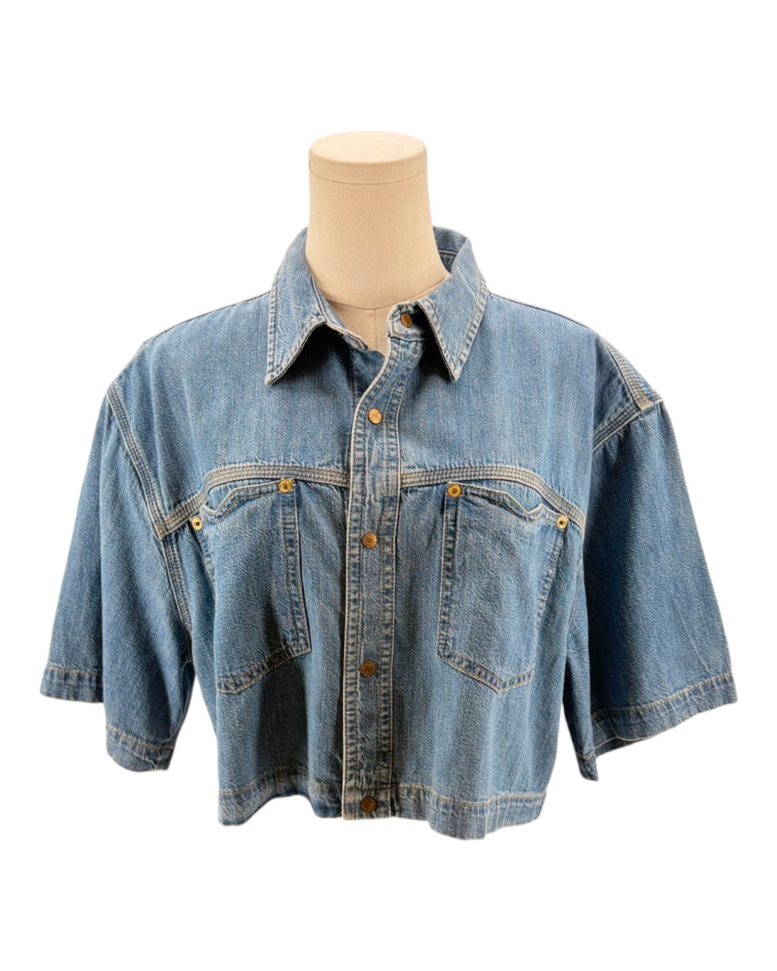 Denim shirt on a mannequin against a white background