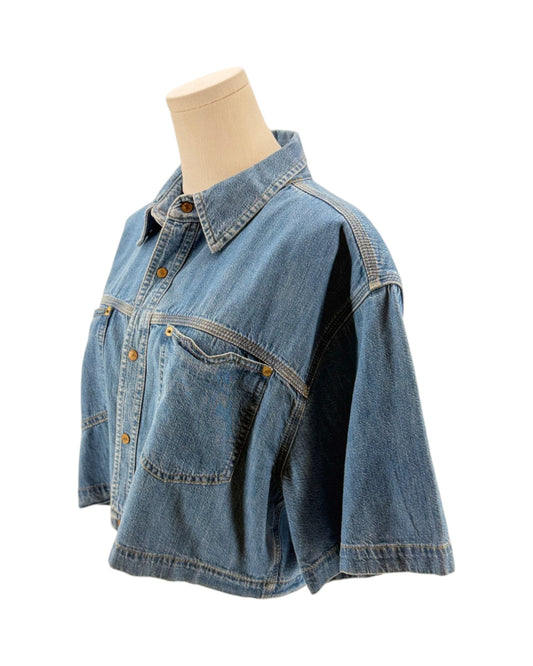 Denim shirt on a mannequin against a white background