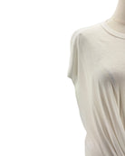 white sleeveless top on a mannequin against a white background