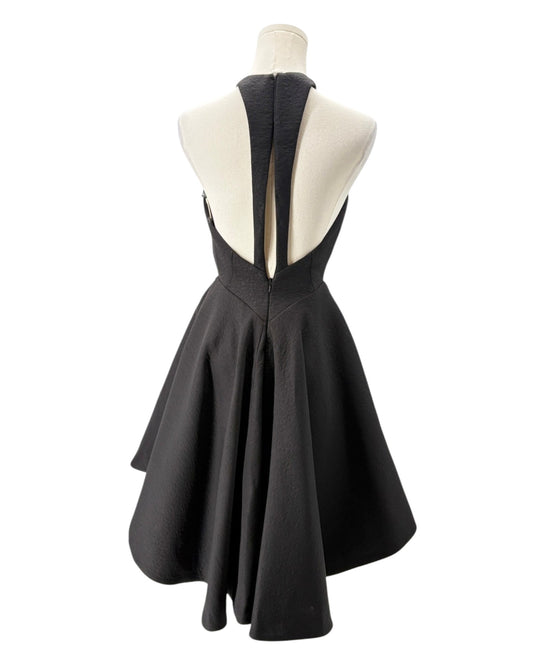 Black dress on a mannequin with a white background