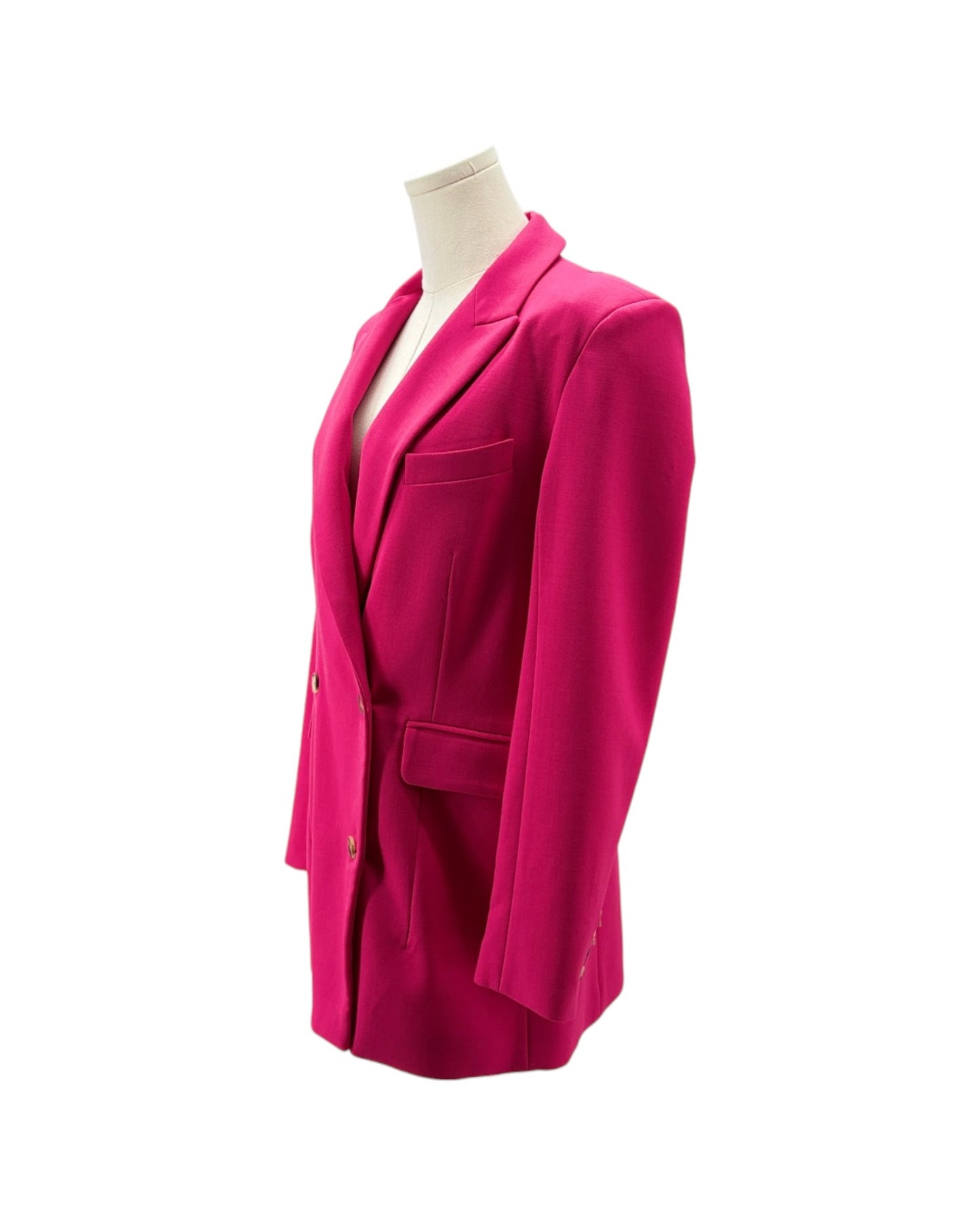 A bright fuchsia pink tailored blazer displayed on a cream mannequin torso against a plain white background.