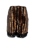 Black and gold sequin shorts on a white background