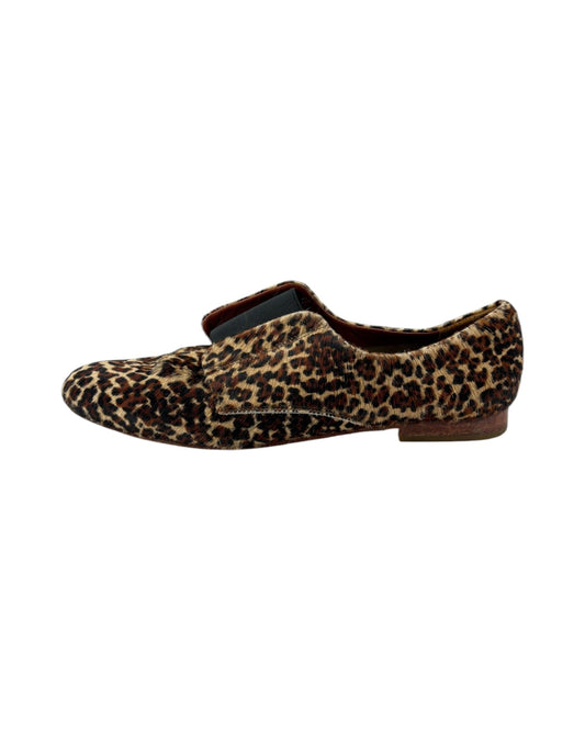 Leopard print loafers on a white background