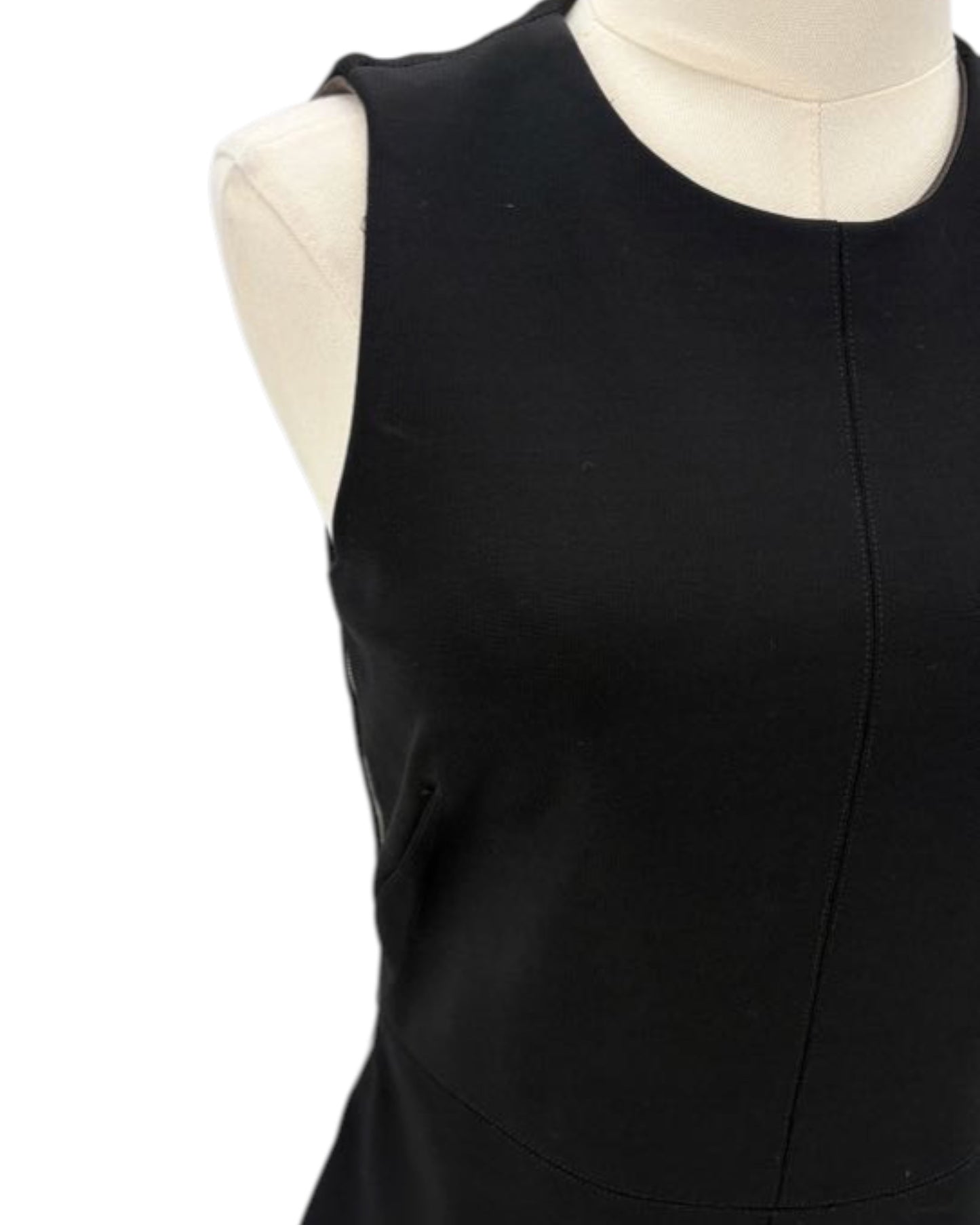 Black sleeveless dress on a mannequin against a white background