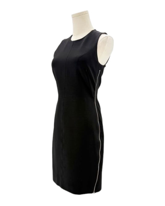 Black sleeveless dress on a mannequin against a white background