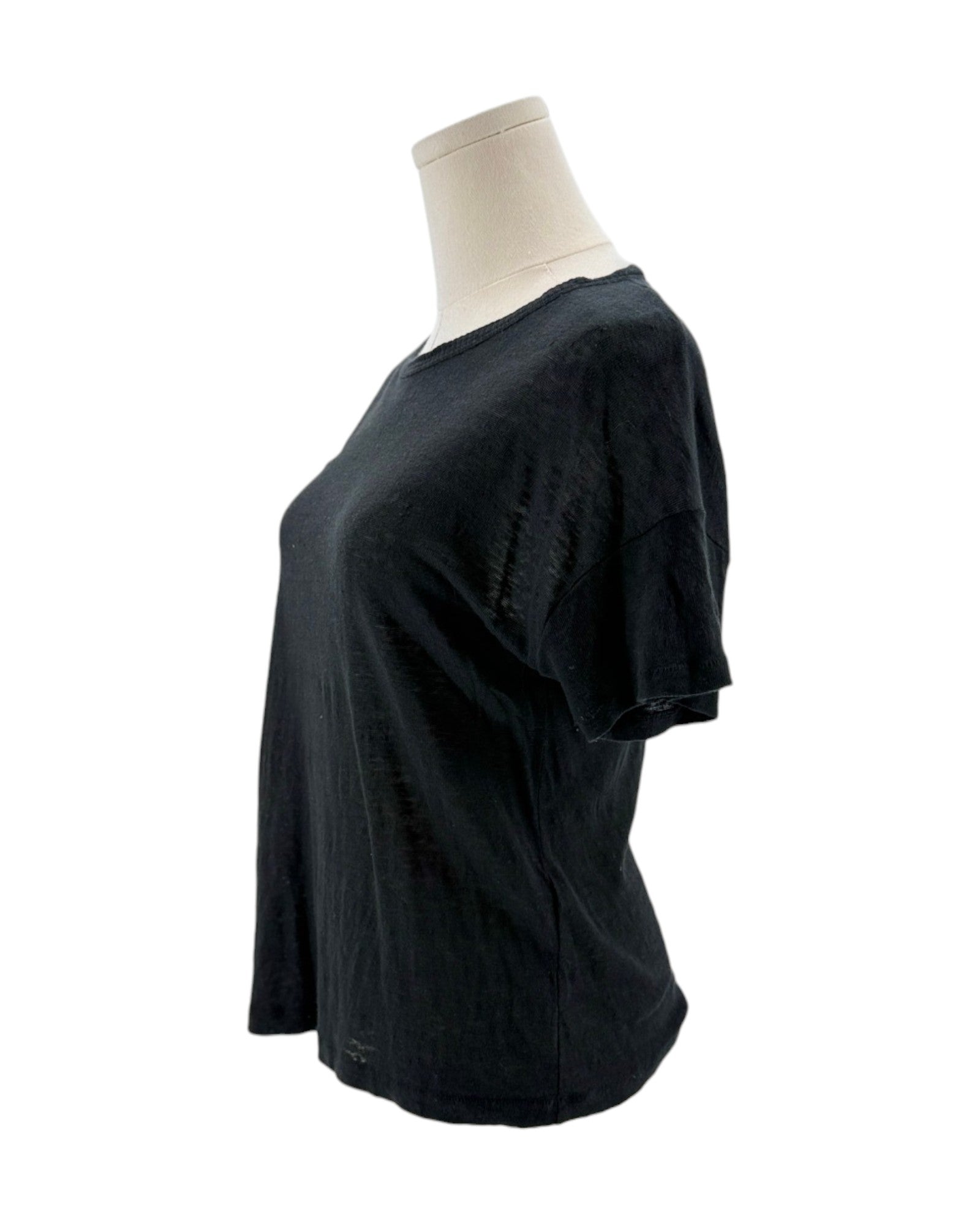Black t-shirt on a mannequin against a white background
