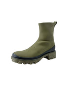 Green rubber boot with a white background