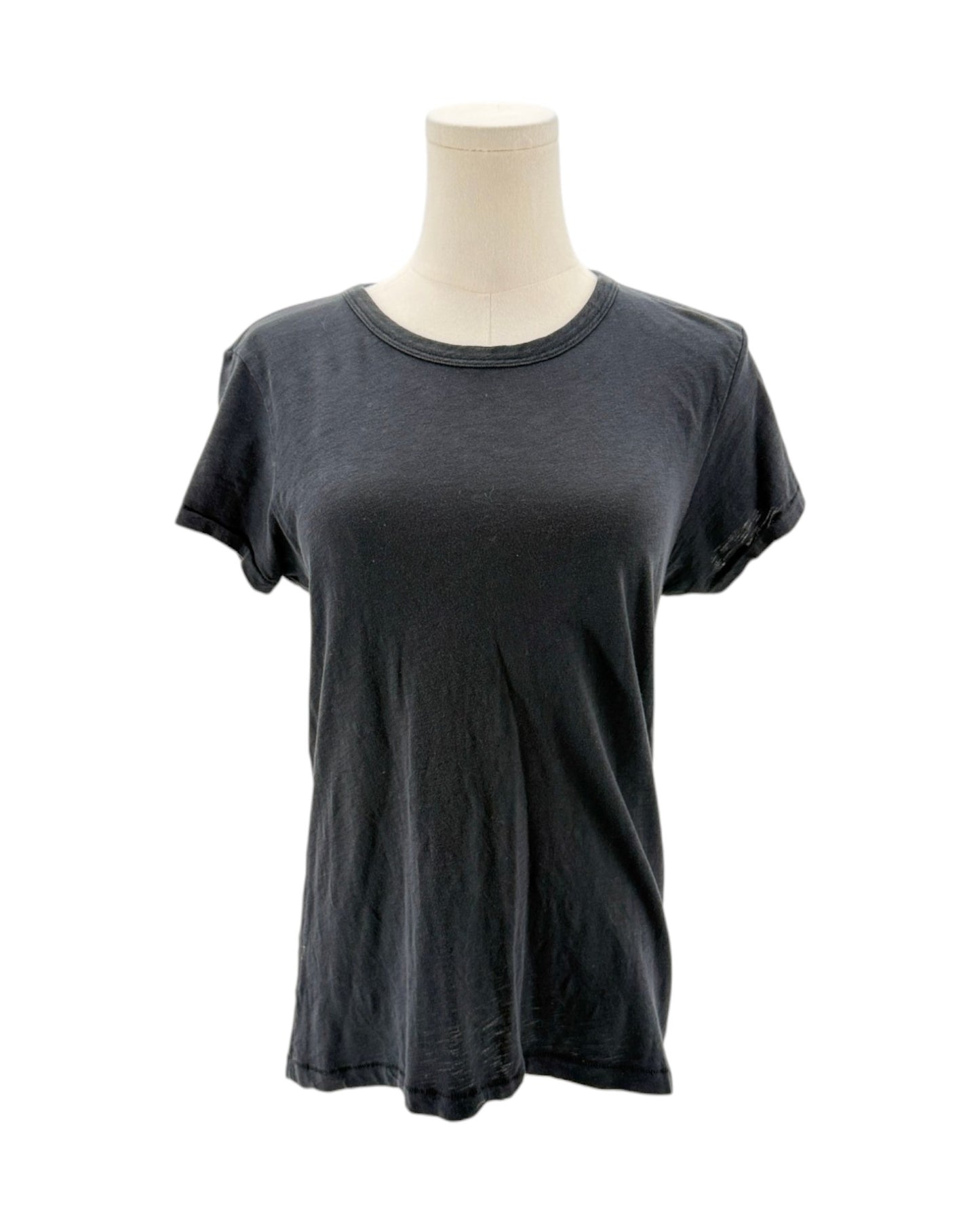 Black t-shirt on a mannequin against a white background