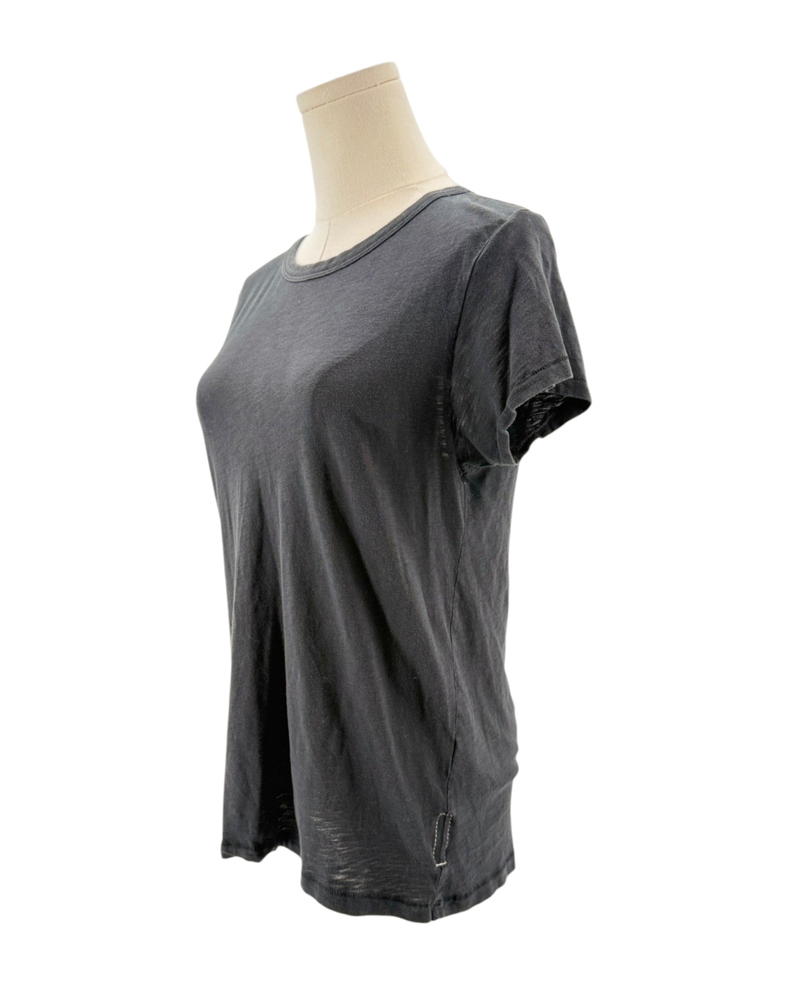 Black t-shirt on a mannequin against a white background