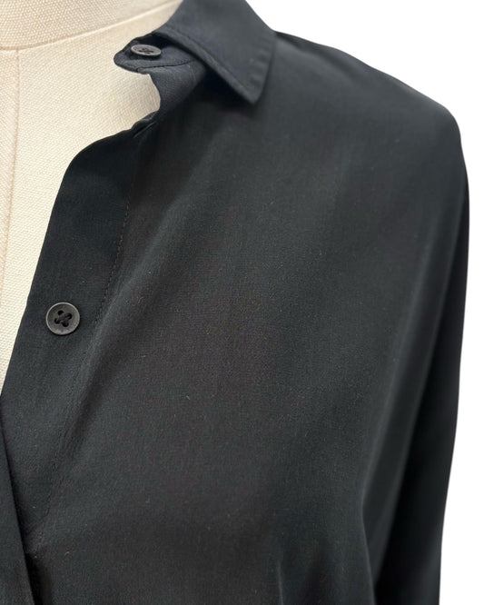 Black top on a mannequin with a white background