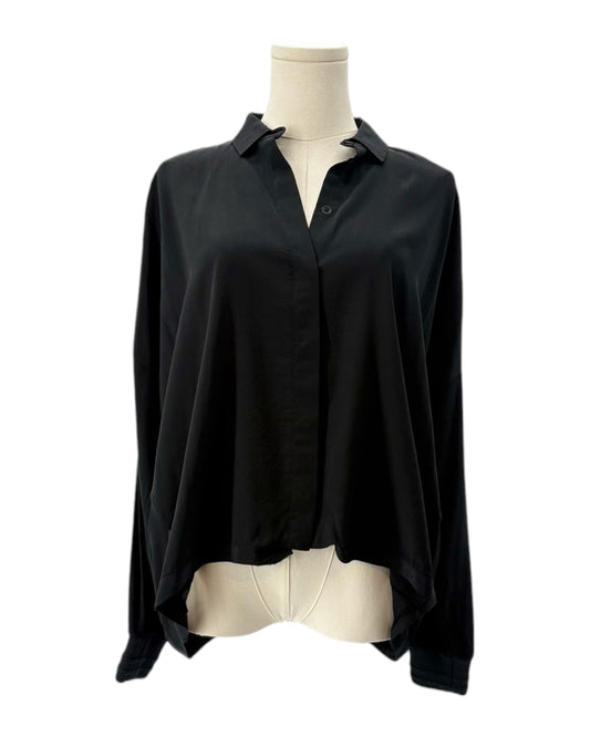 Black shirt on a mannequin with a white background
