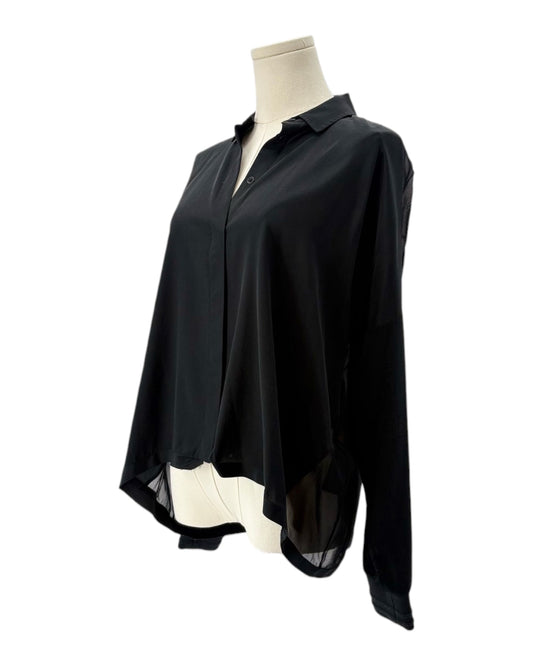 Black shirt on a mannequin against a white background