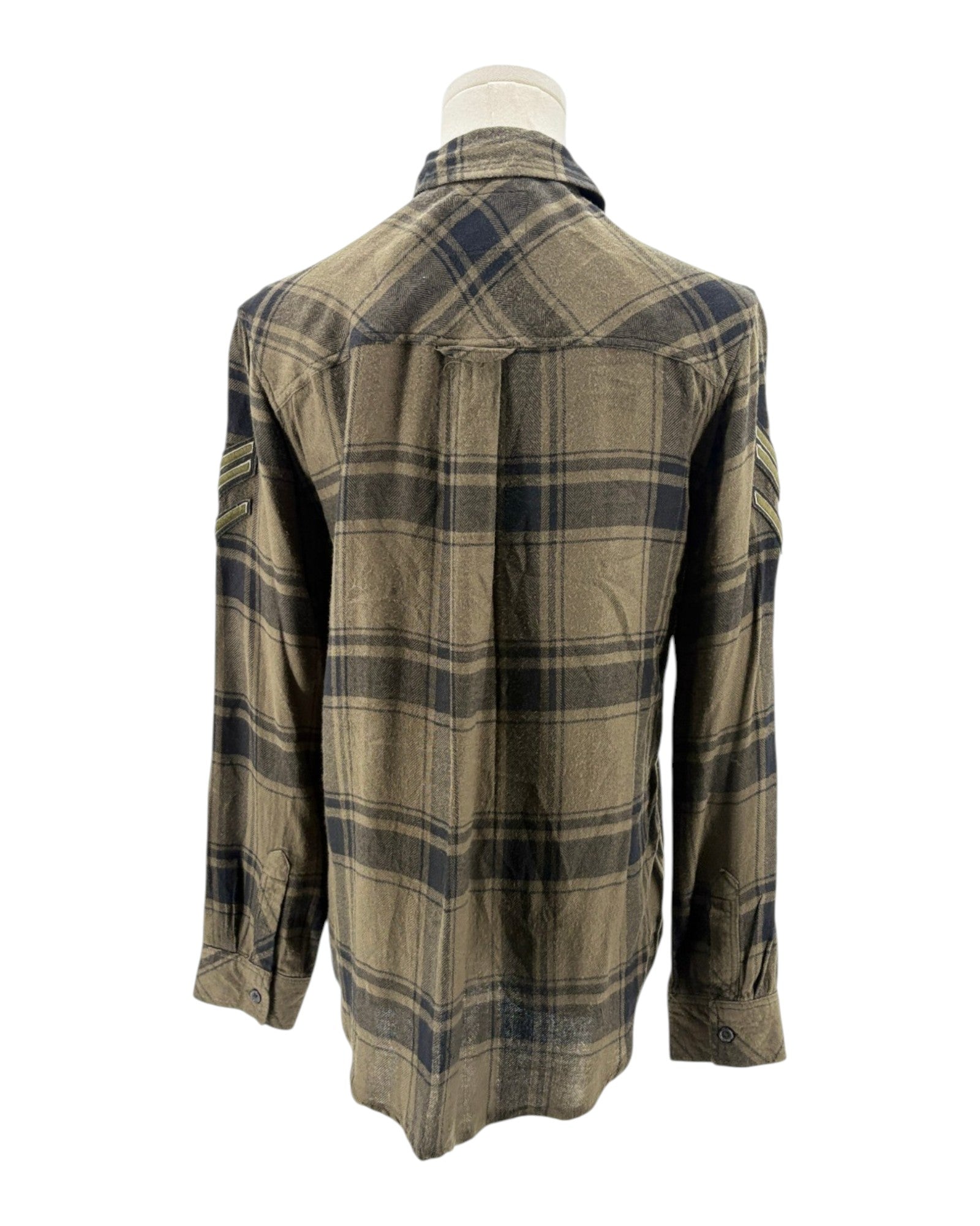 Plaid shirt on a mannequin against a white background