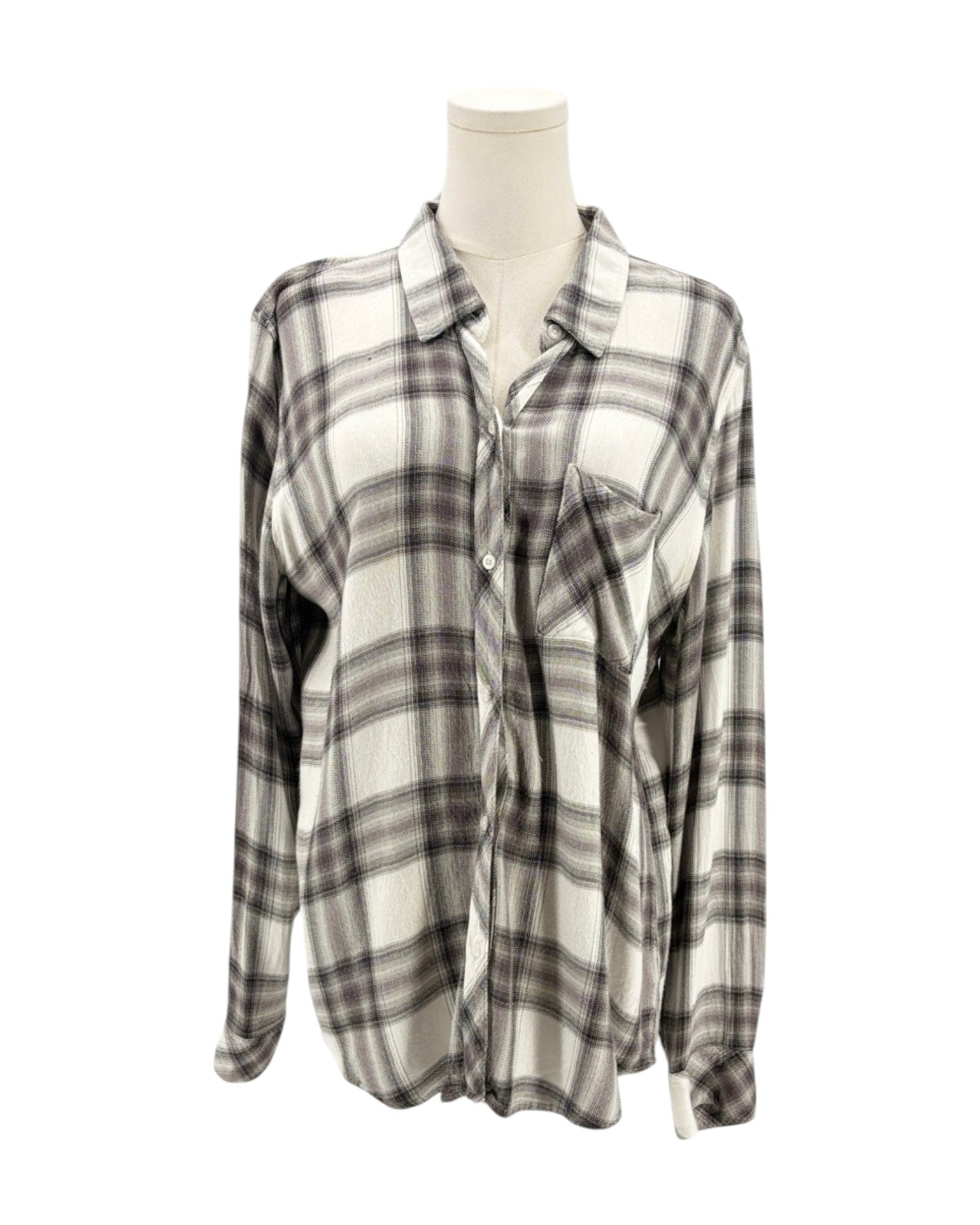 Plaid shirt on a mannequin against a white background
