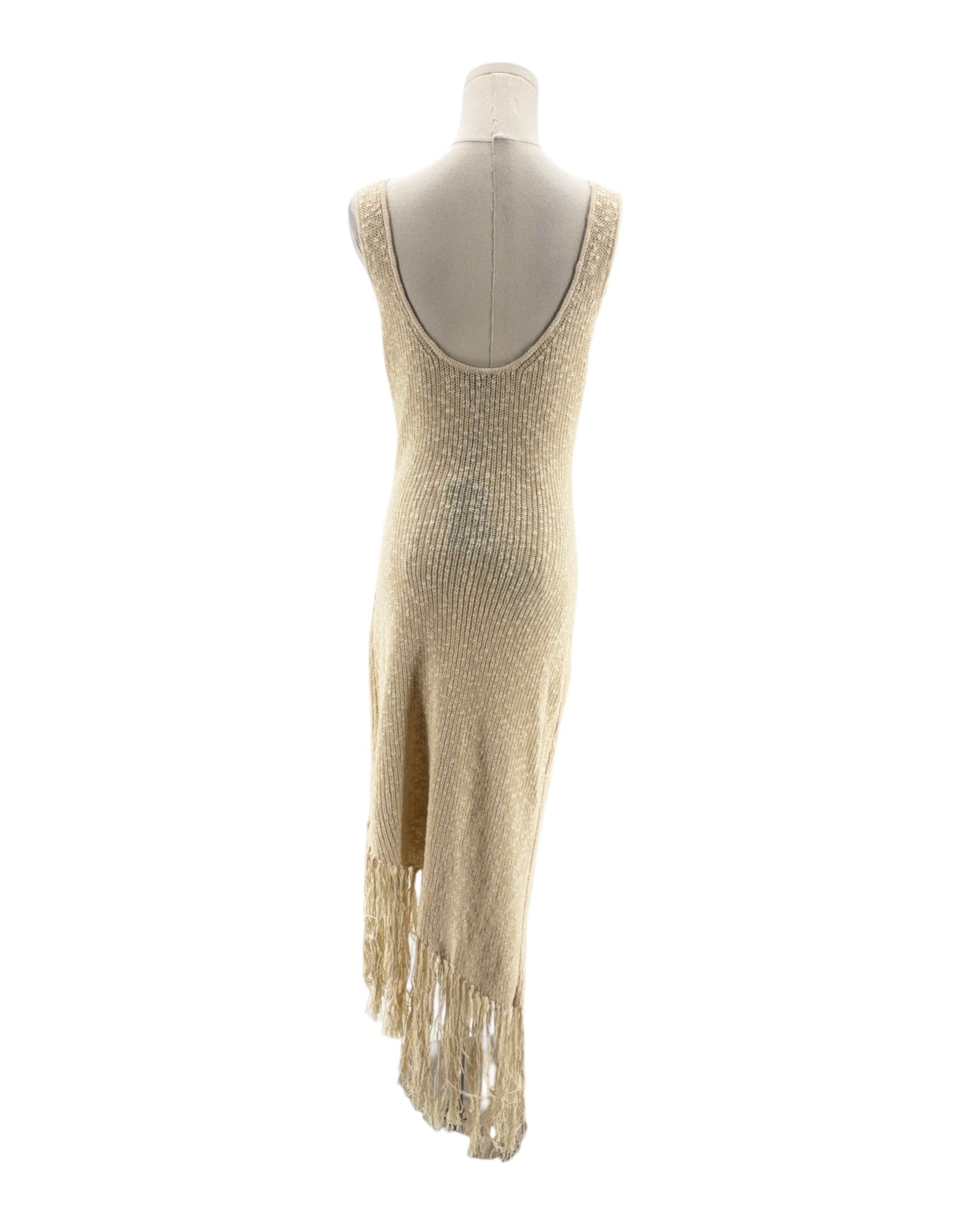 Beige fringe dress on a mannequin against a white background