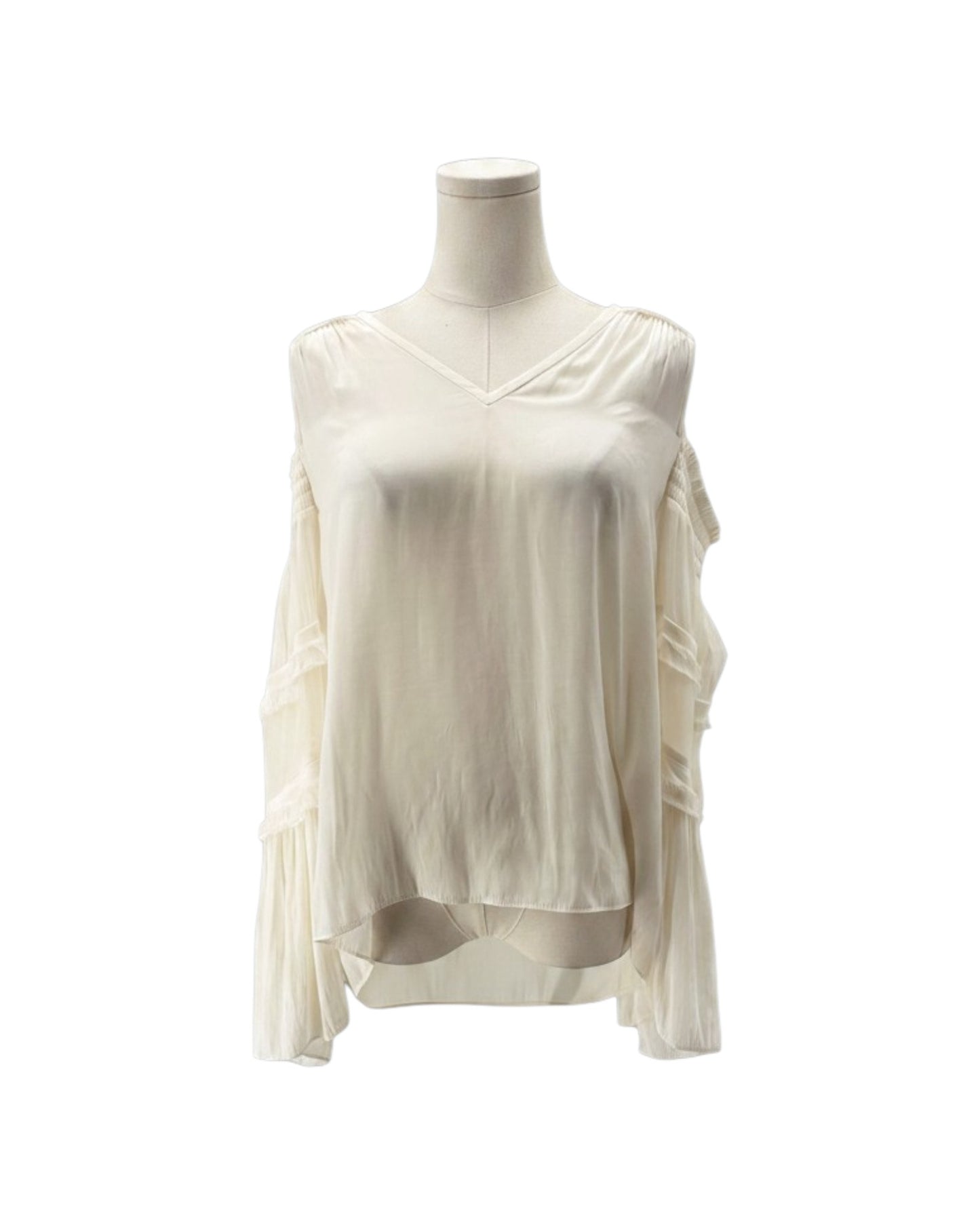 An off-white, long-sleeve blouse with a V-neckline and layered ruffle details on the sleeves, displayed on a mannequin torso against a plain white background.