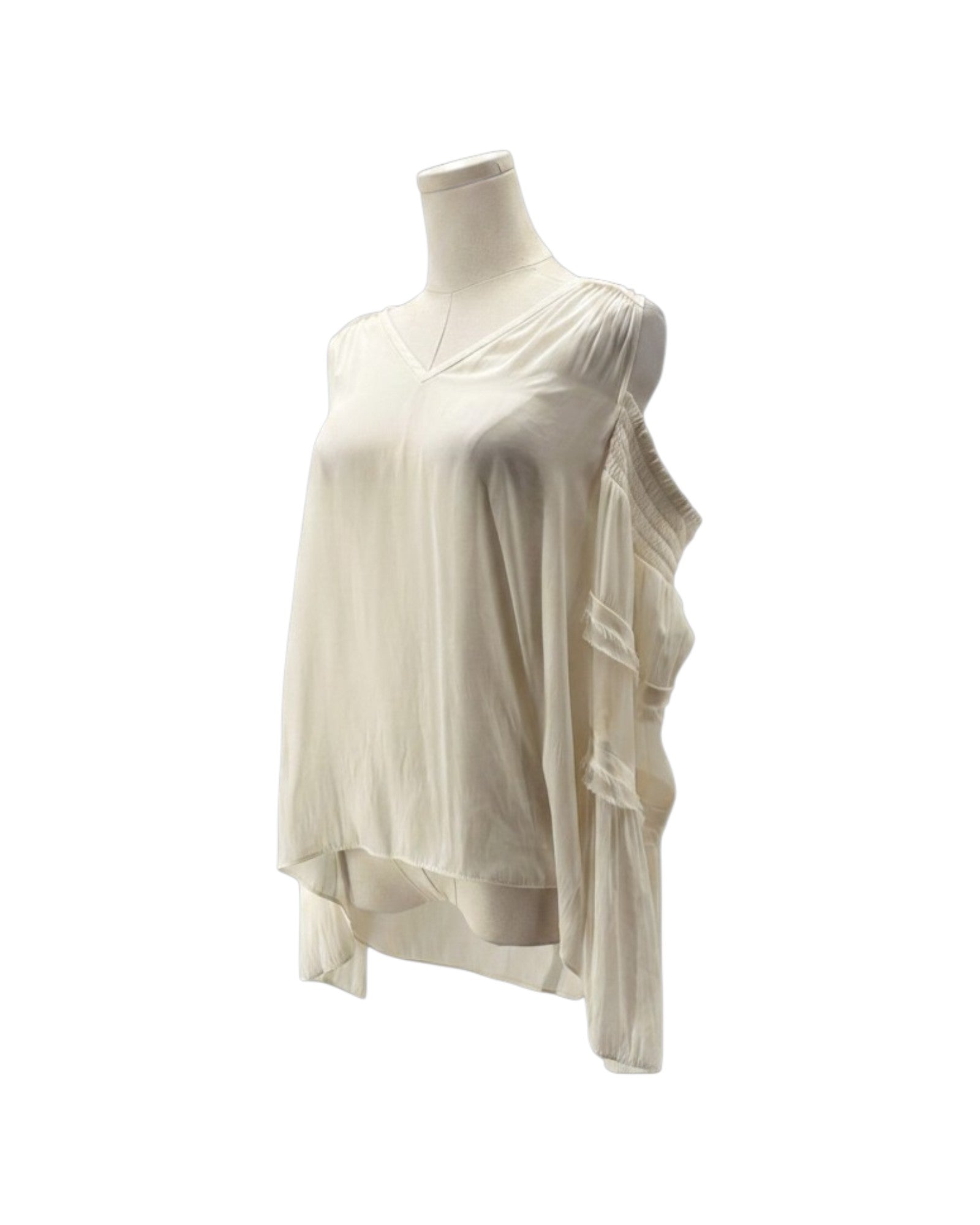 An off-white, asymmetrical draped top displayed on a mannequin torso against a plain white background.