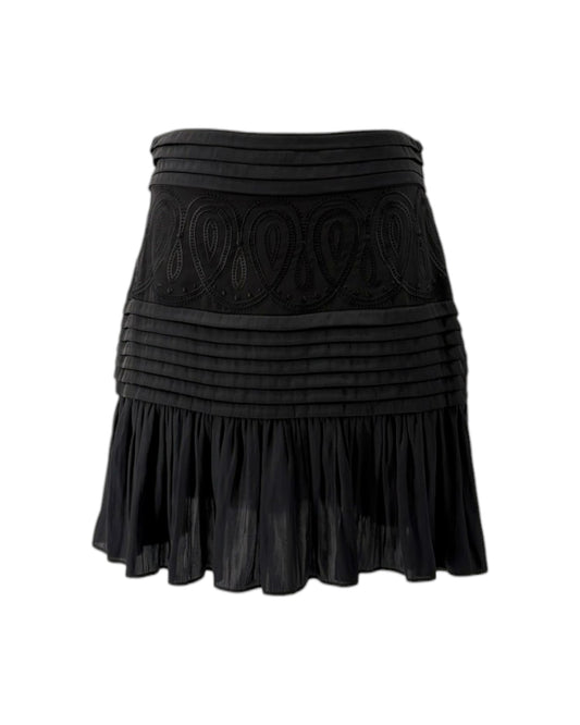 Black skirt with decorative patterns on a white background