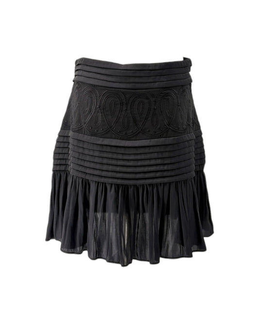 Black pleated skirt on a white background