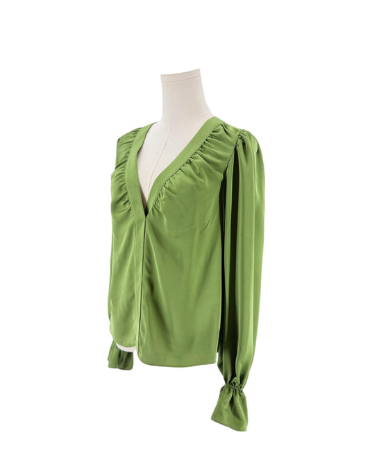 A sage green long-sleeve blouse with a gathered V-neckline and drawstring cuffs, displayed on a cream mannequin torso against a white background.