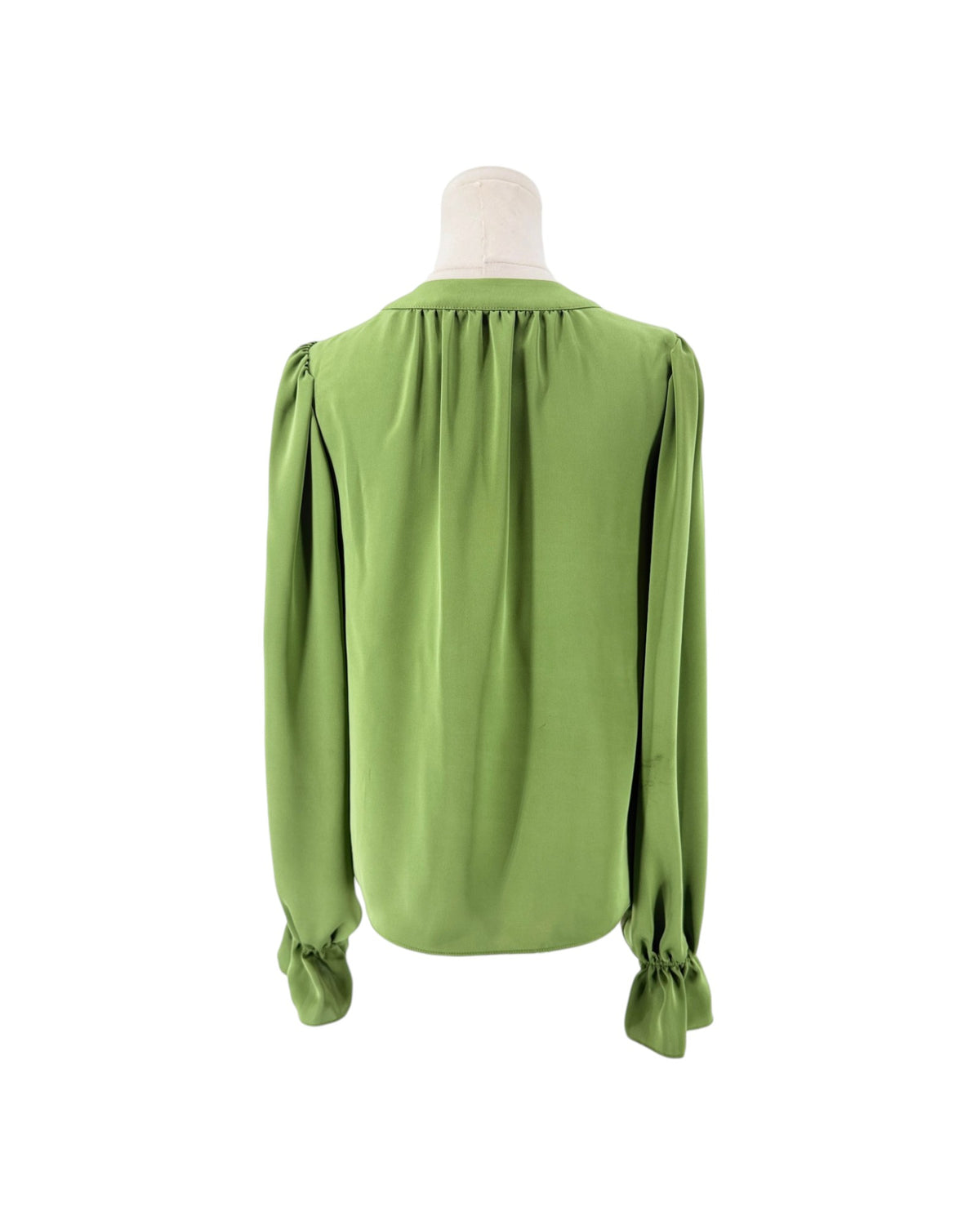 A sage green long-sleeve blouse with gathered shoulders and ruffled cuffs, displayed on a mannequin torso against a plain white background.