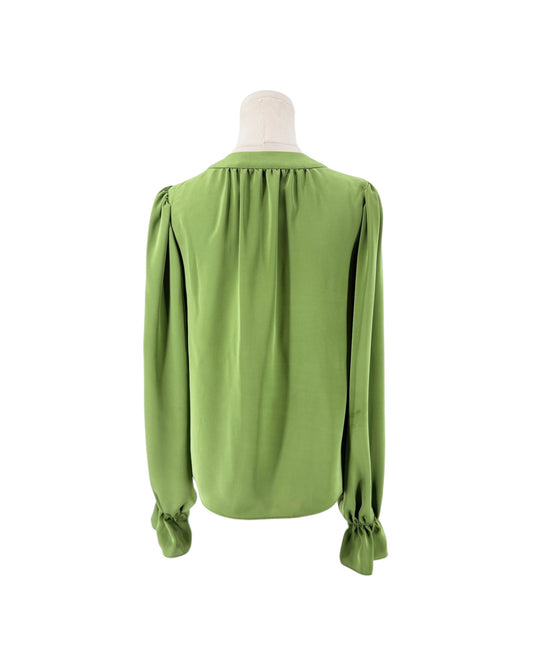 A sage green long-sleeve blouse with gathered shoulders and ruffled cuffs, displayed on a mannequin torso against a plain white background.
