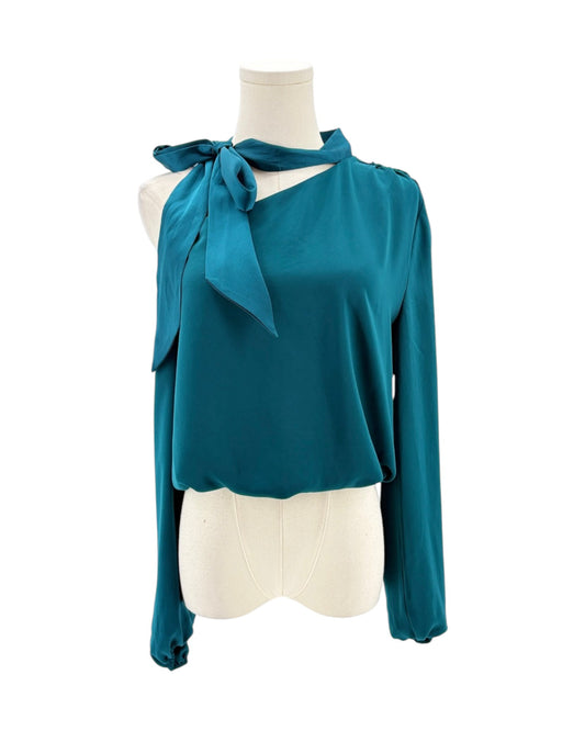 Teal blouse with a bow neckline on a mannequin against a white background