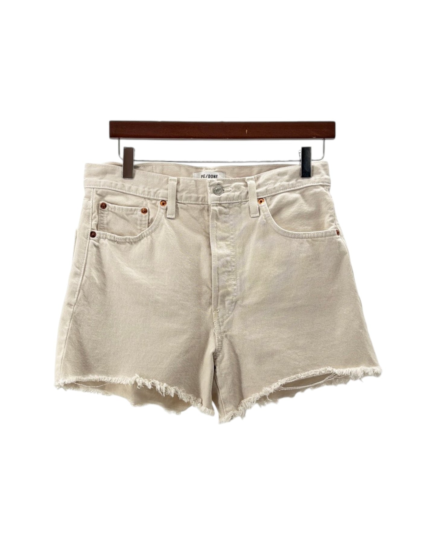 Beige denim shorts on a hanger against a white background