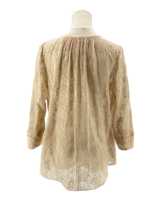 cream blouse with embroidery on a mannequin against a white background