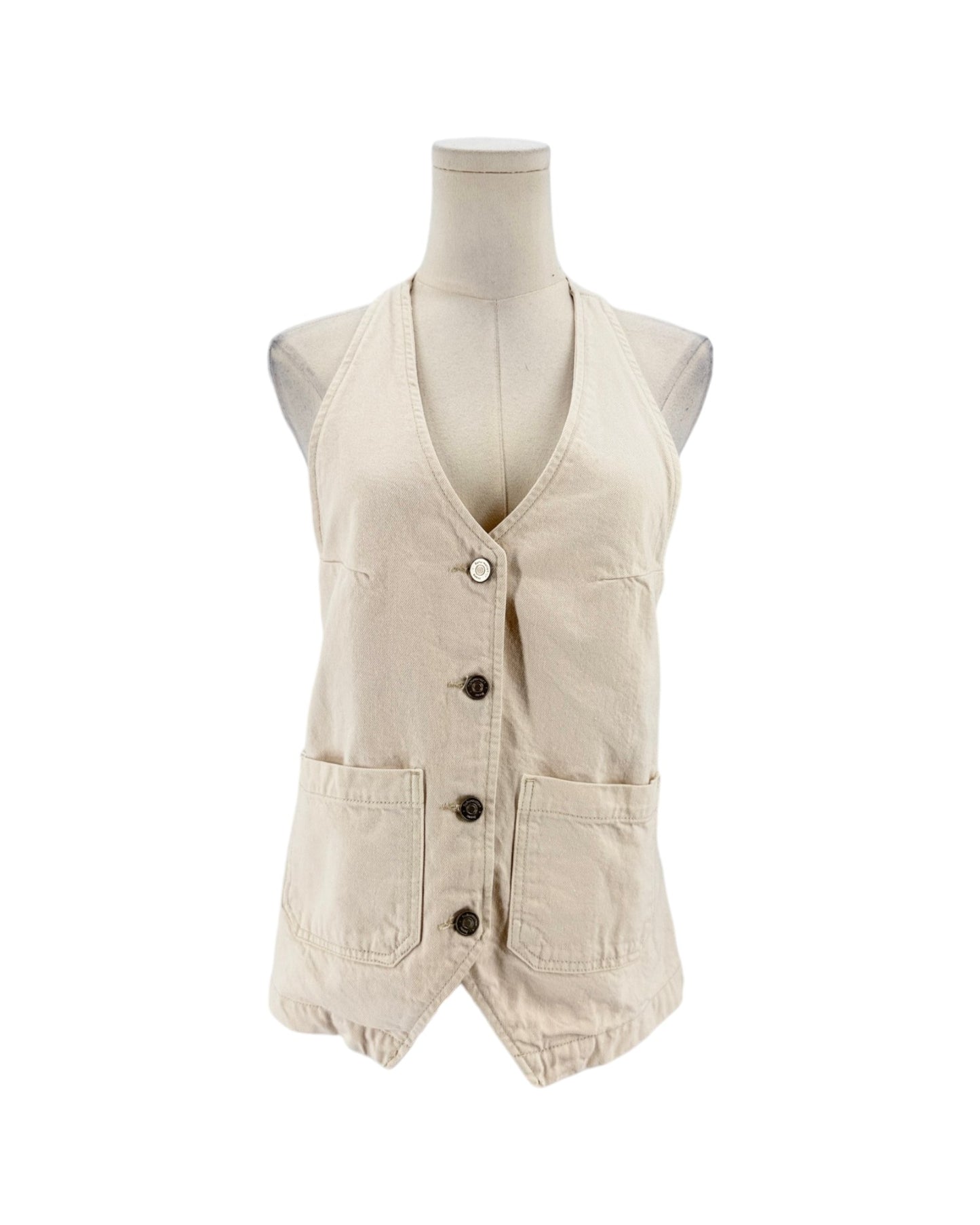A sleeveless beige vest displayed on a mannequin torso against a plain white background. The vest has a V-neck, front button closure, and two large front patch pockets.