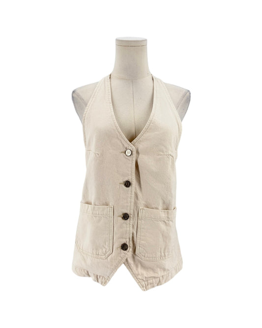A sleeveless beige vest displayed on a mannequin torso against a plain white background. The vest has a V-neck, front button closure, and two large front patch pockets.