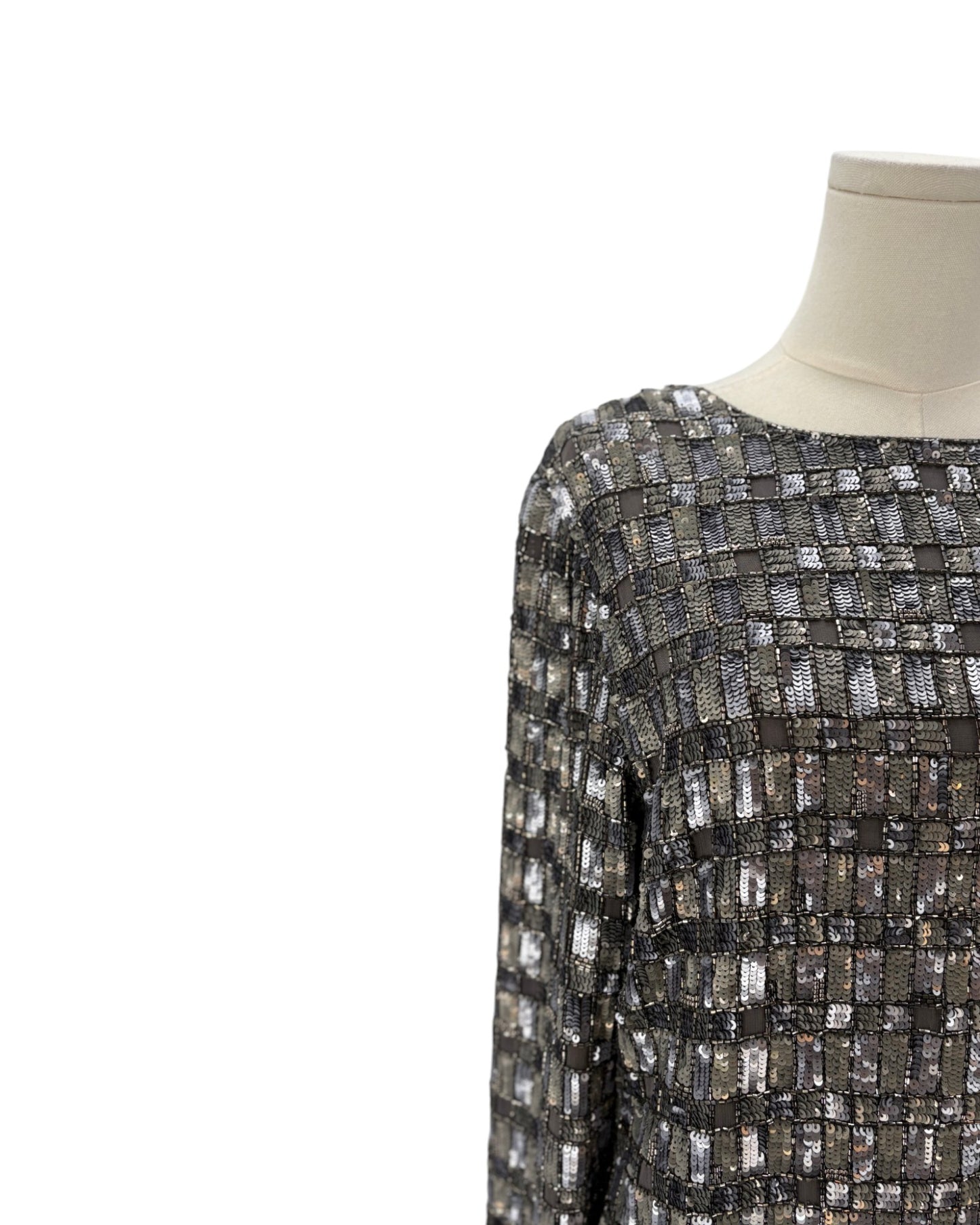 Silver patterned dress on a mannequin against a white background