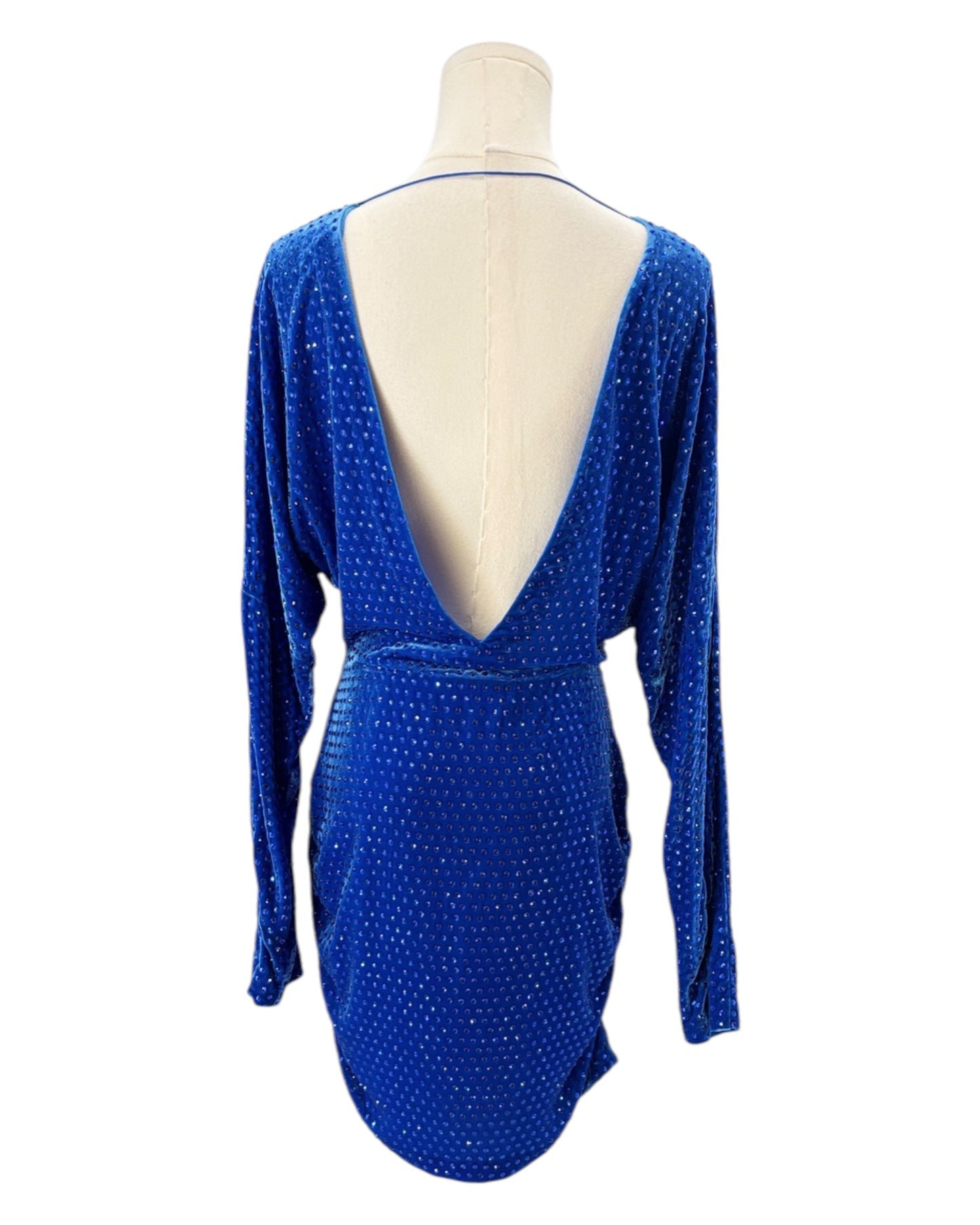 Blue dress with a plunging neckline on a mannequin against a white background