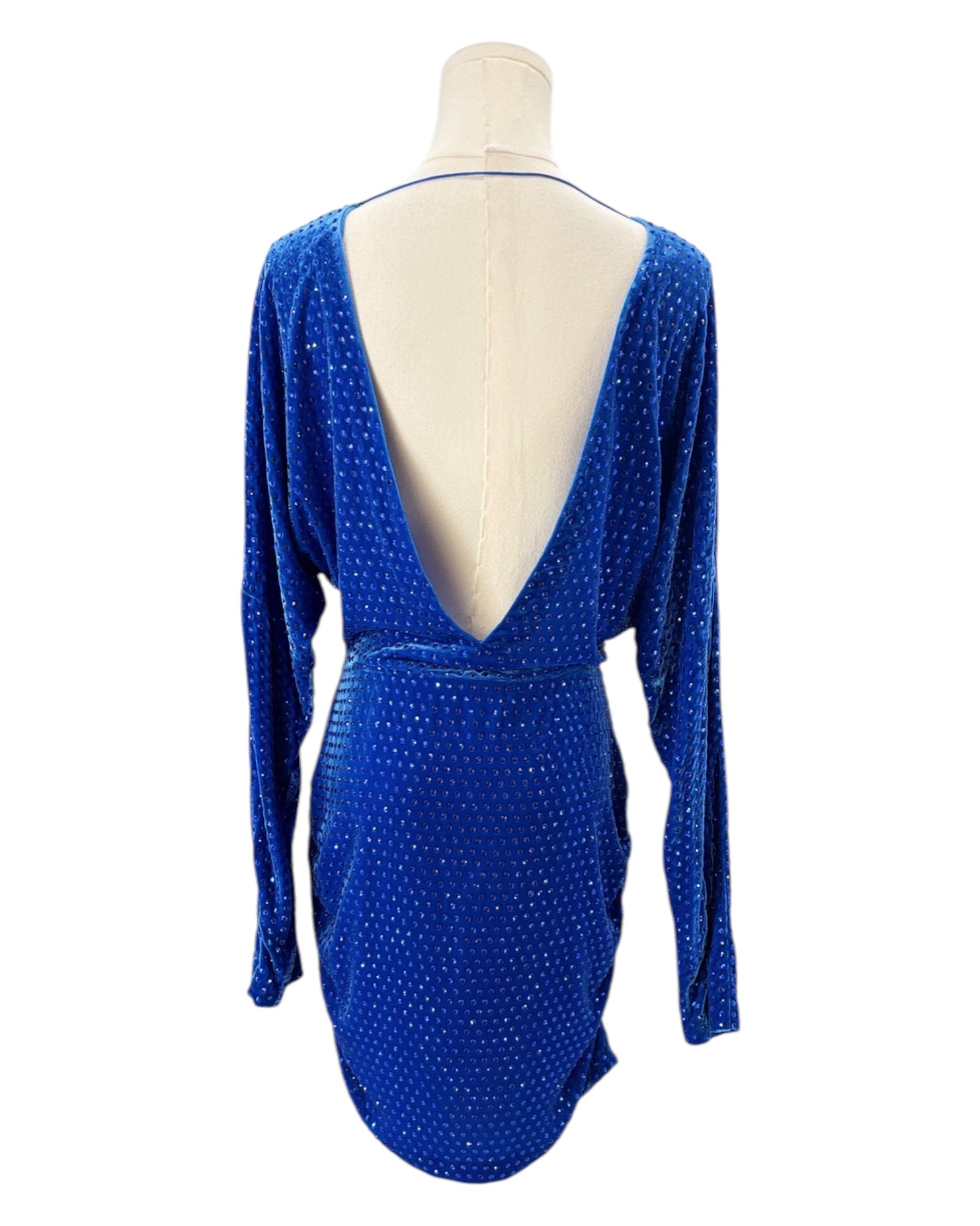Blue dress with a plunging neckline on a mannequin against a white background