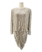 Gold sequin dress on a mannequin against a white background