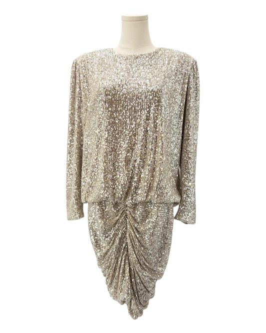 Gold sequin dress on a mannequin against a white background