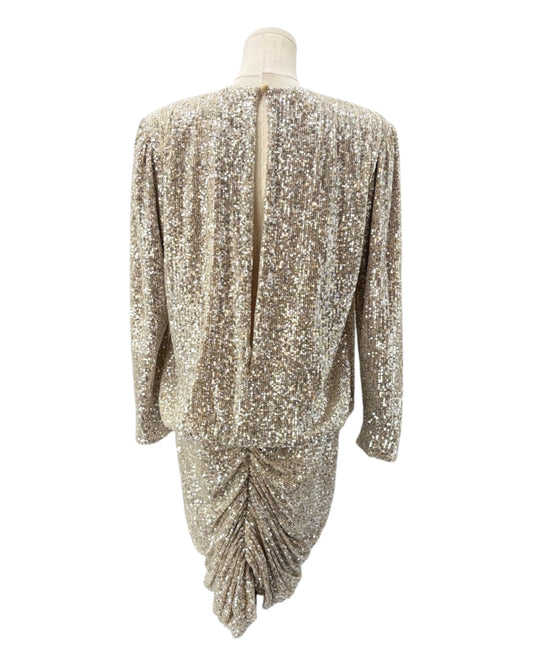 Gold sequin dress on a mannequin against a white background