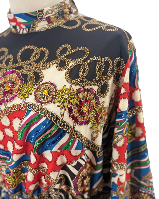 Colorful embroidered garment with intricate patterns on a white background