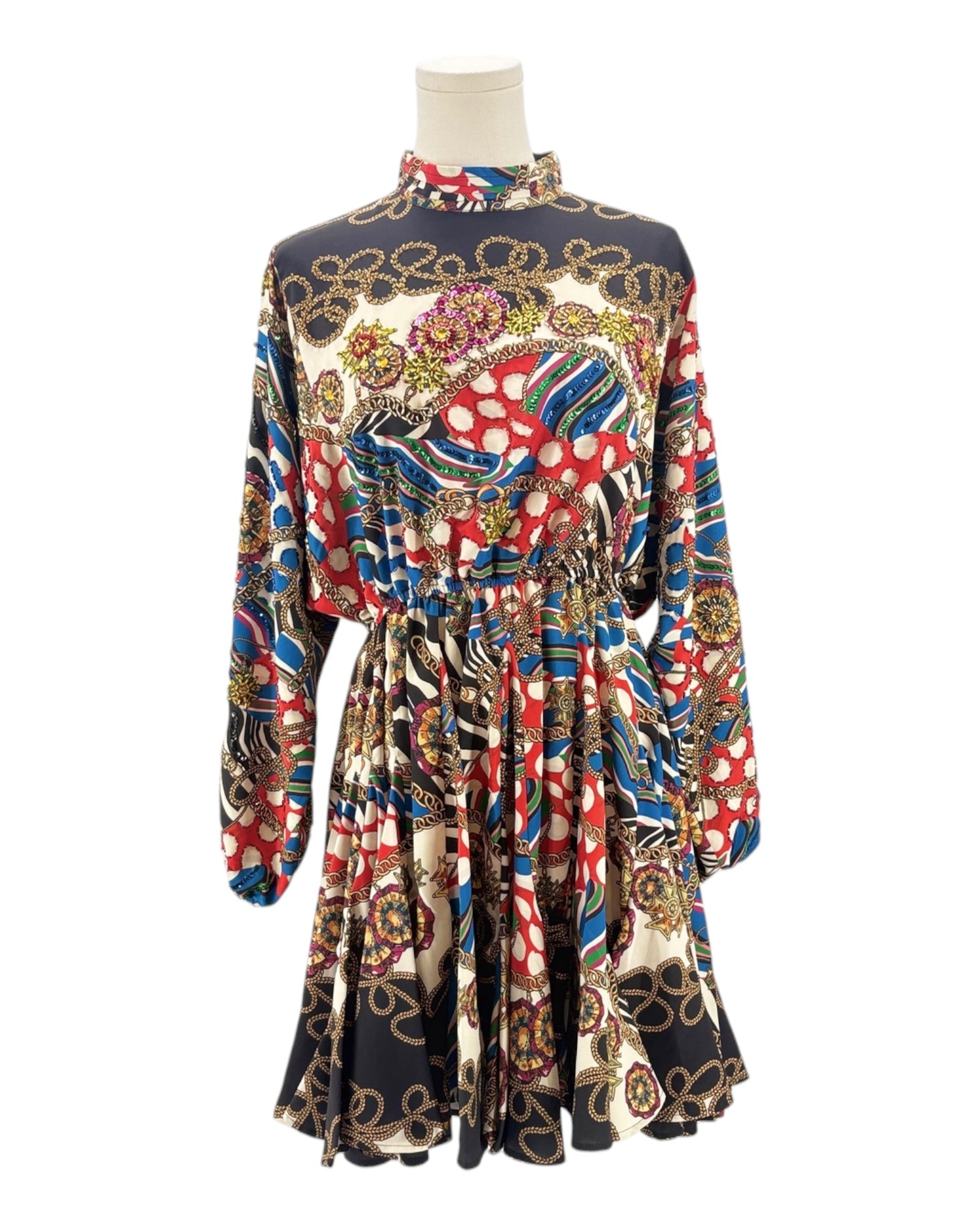 Colorful patterned dress on a mannequin against a white background