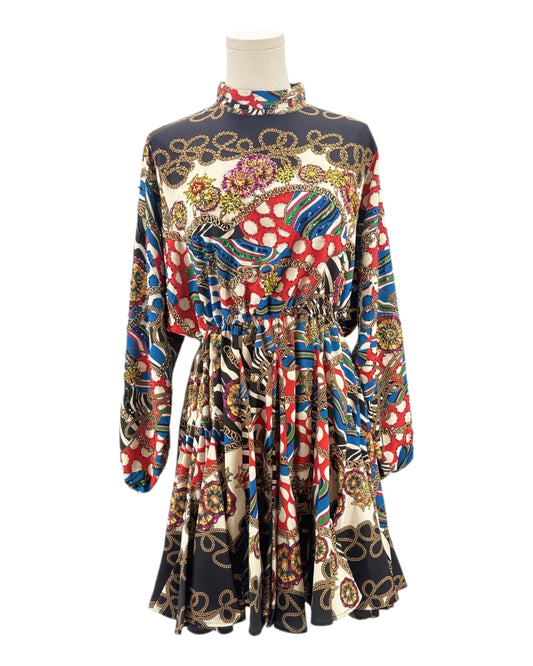 Colorful patterned dress on a mannequin against a white background