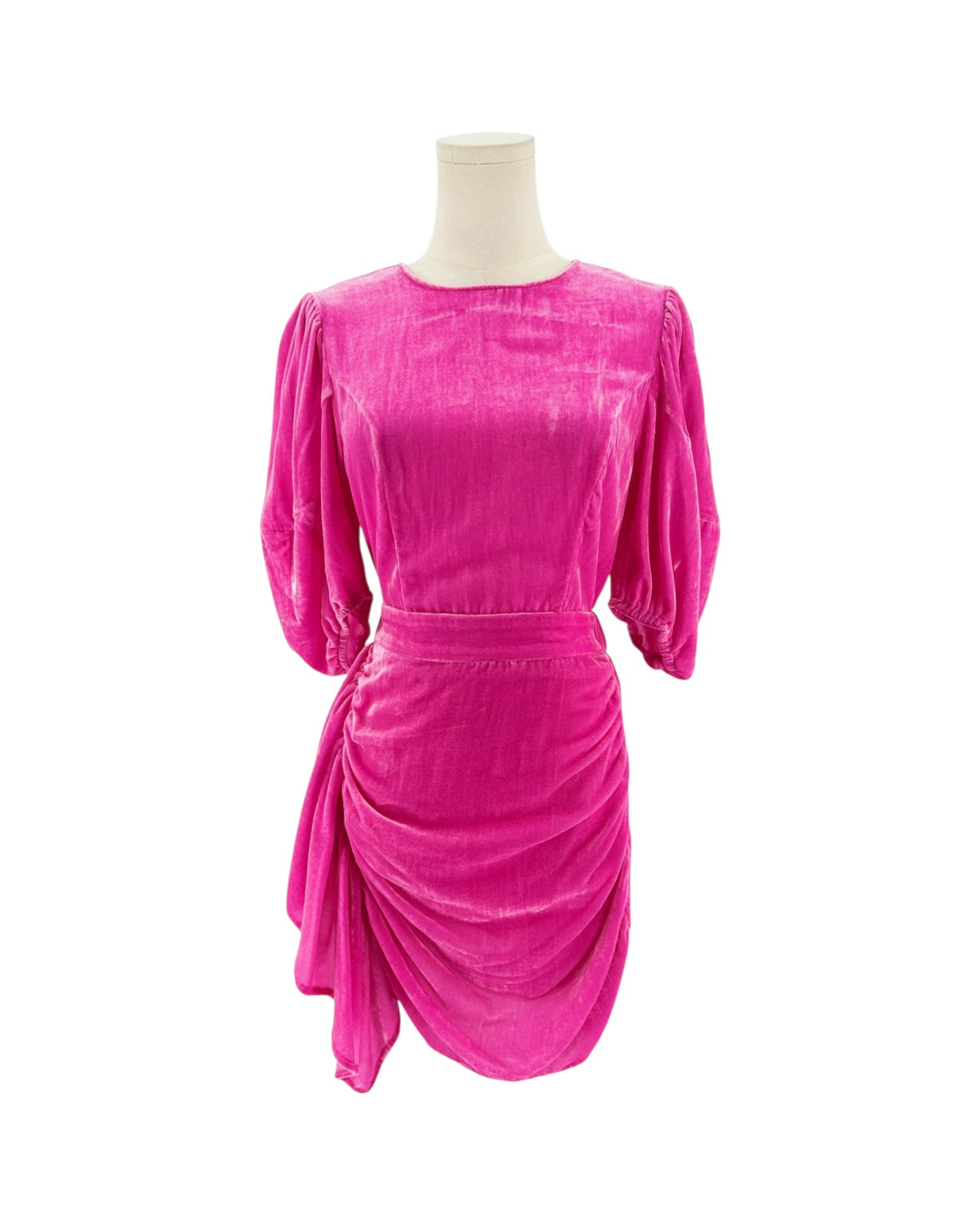 A bright magenta pink velvet dress on a mannequin, showing the back of the neck, three-quarter puffed sleeves, and a matching fabric belt at the waist against a plain white background.