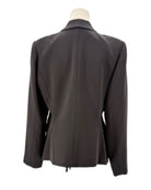 Black blazer on a mannequin against a white background