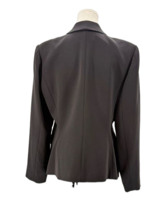 Black blazer on a mannequin against a white background