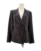 Black blazer on a mannequin against a white background