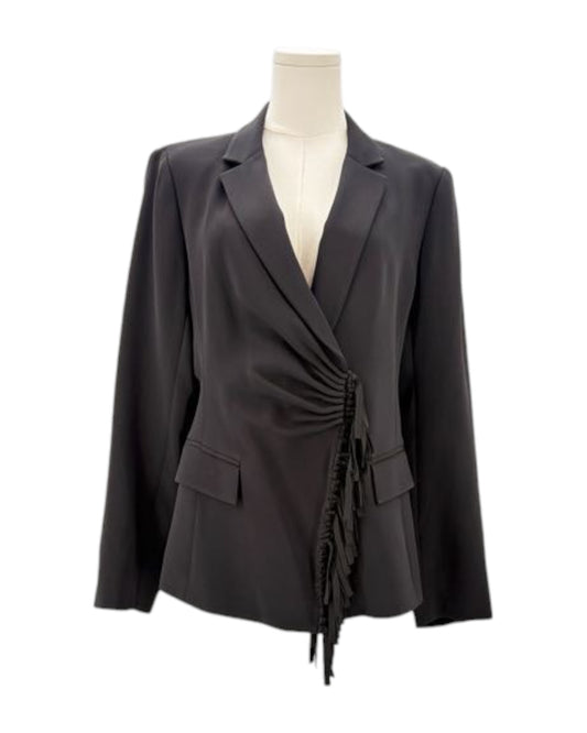 Black blazer on a mannequin against a white background